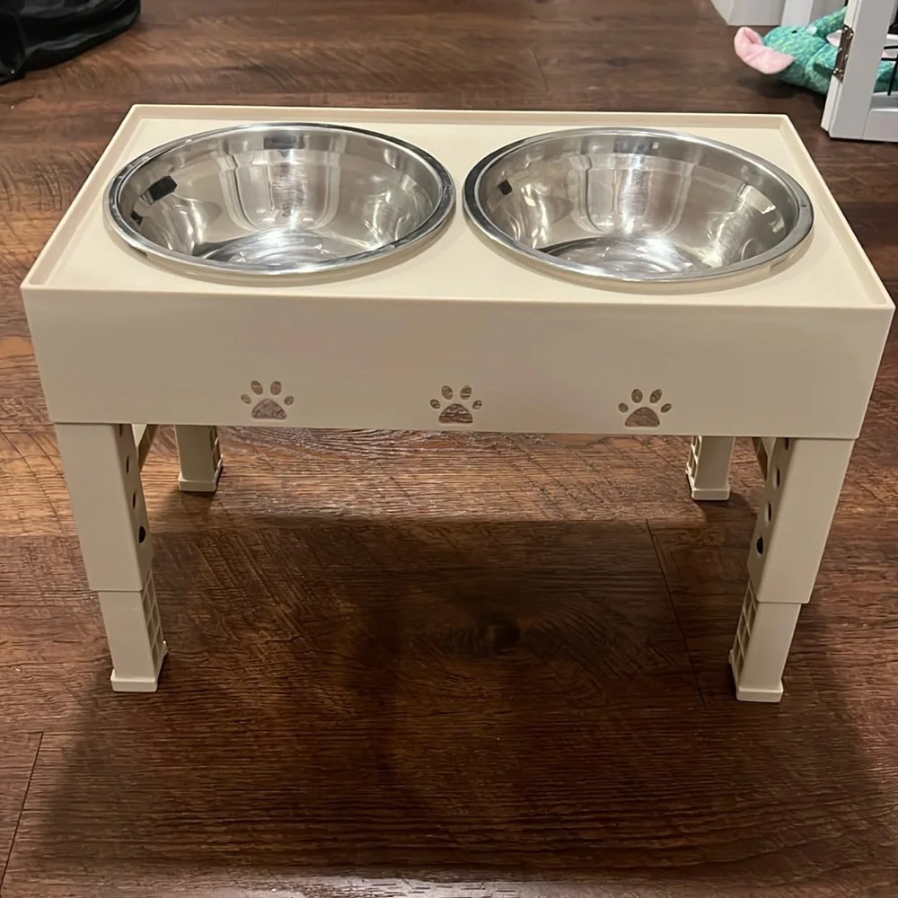Cream Colored Dog Feeder and Bowls